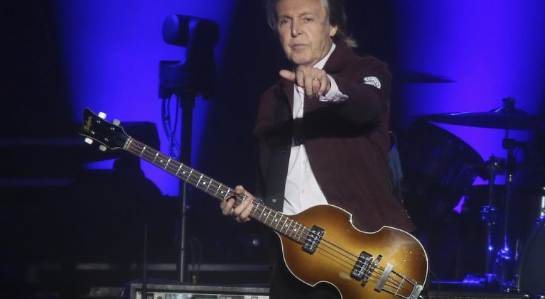 Sir Paul McCartney spotted making his own guitar picks with flattened pennies